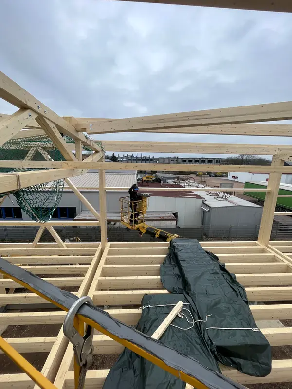 Timber roof framing installed above the commercial building structure