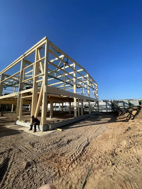 Combined steel and timber primary structure during installation