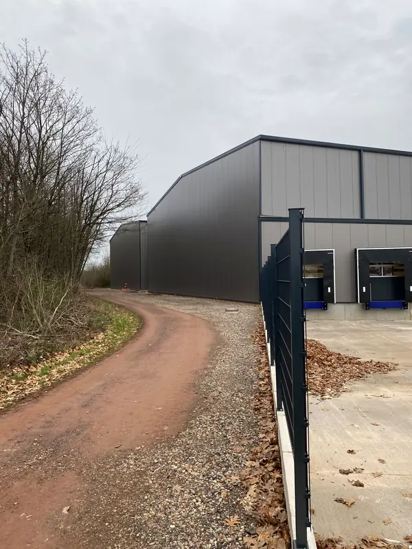 Completed dark rear elevation of the warehouse building