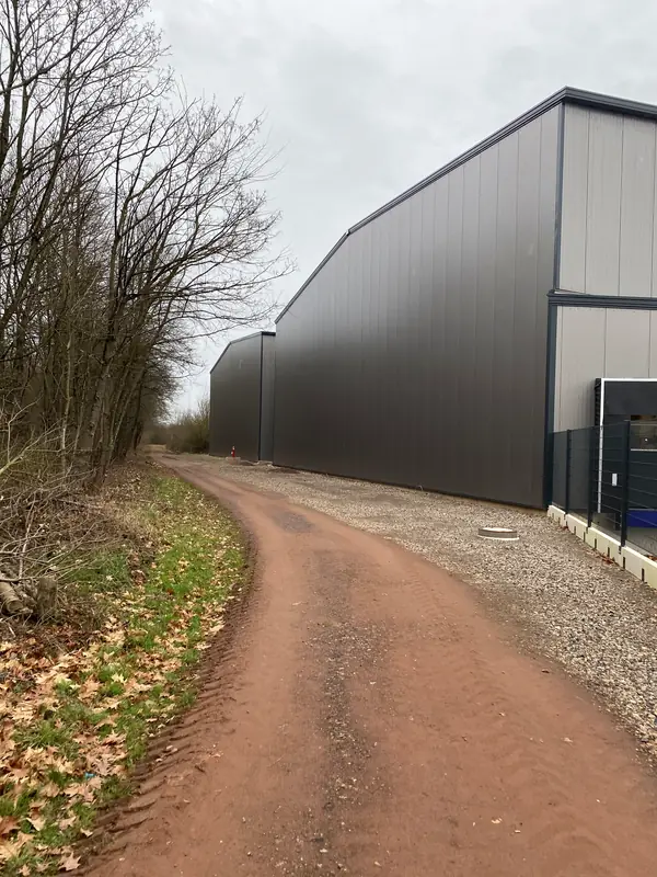 Long completed sandwich-panel elevation of the warehouse building