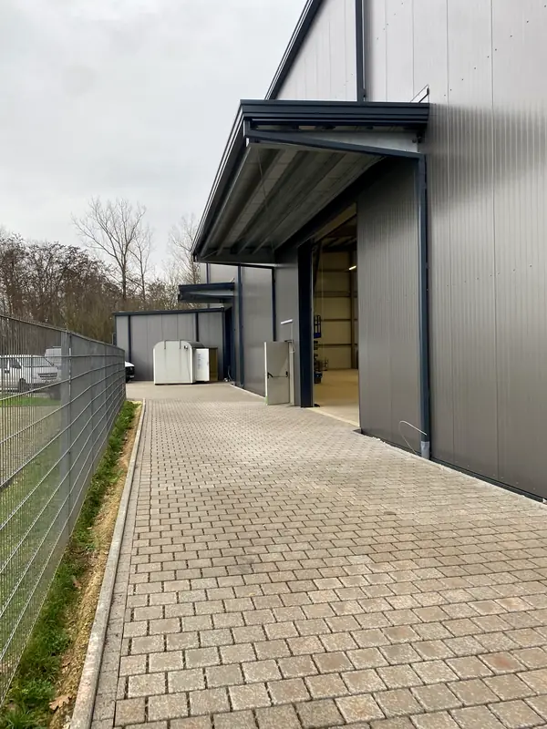 Completed service-yard elevation and entrance canopy