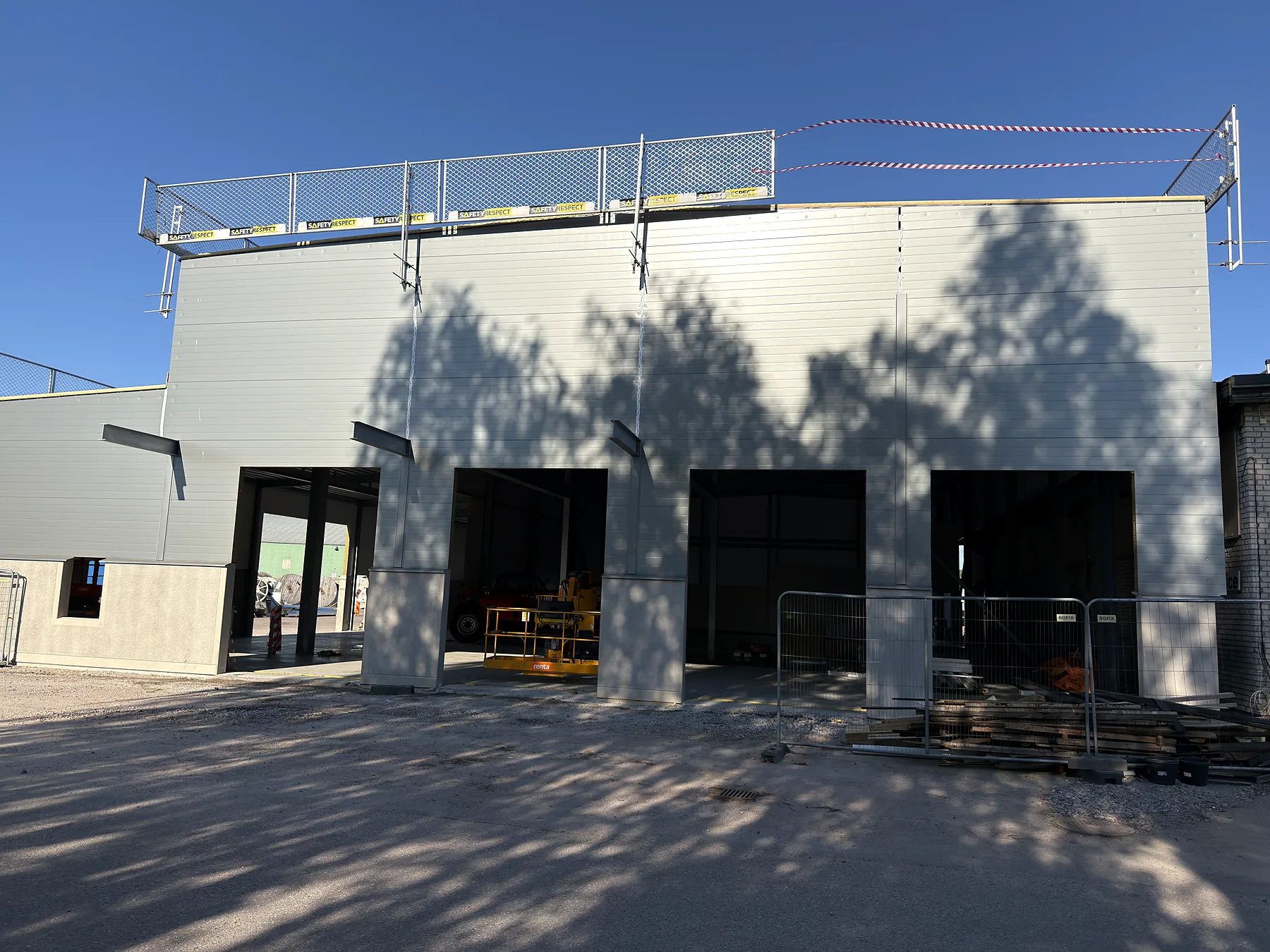 Industrial garage façade after sandwich-panel and roof works in Jönköping